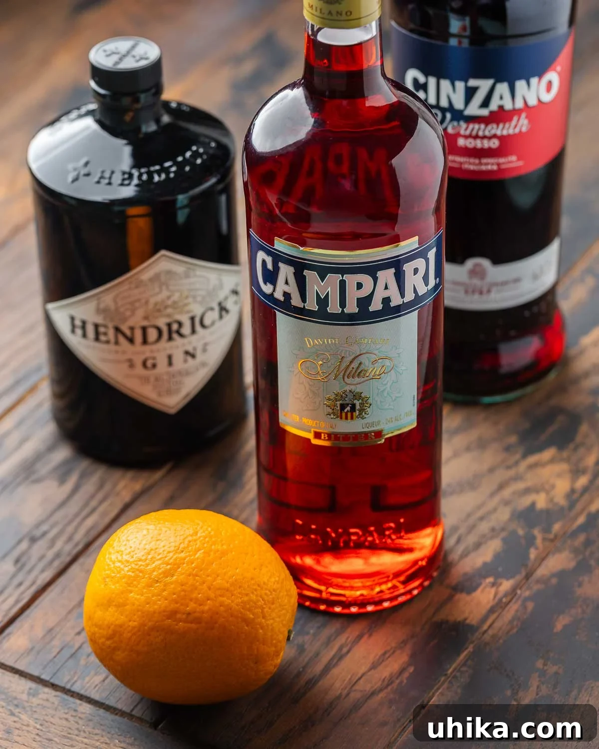 Timeless Negroni 3 Ingredients shown: gin, Campari, sweet vermouth, and one orange.