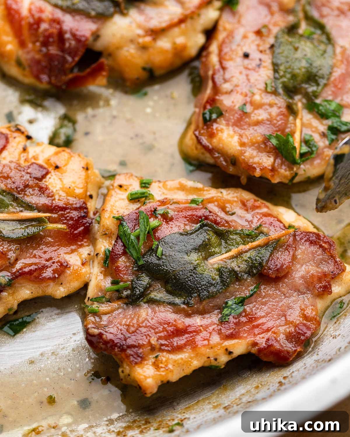 Prosciutto and Sage Chicken Saltimbocca 10 Close up shot of one piece of chicken saltimbocca, showing the layers of prosciutto and sage.