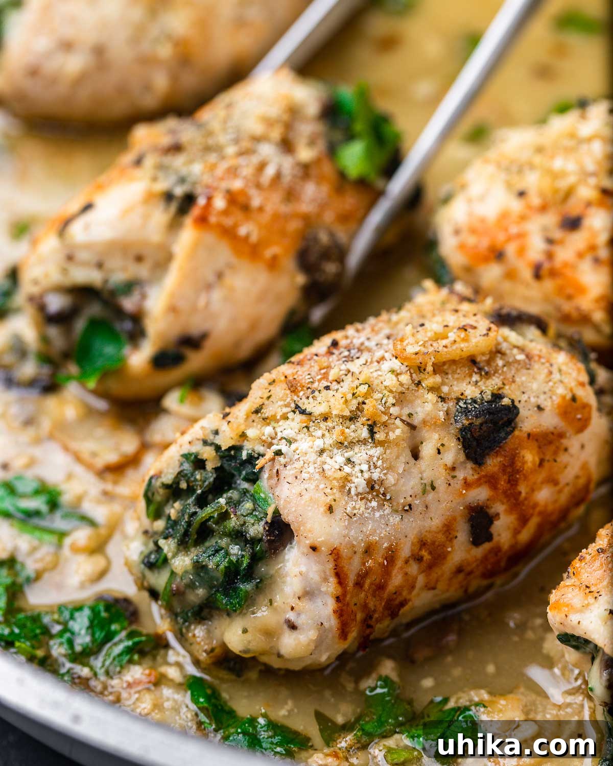 Stuffed Chicken Roulades 9 Chicken involtini beautifully arranged in a large pan, ready to be served.