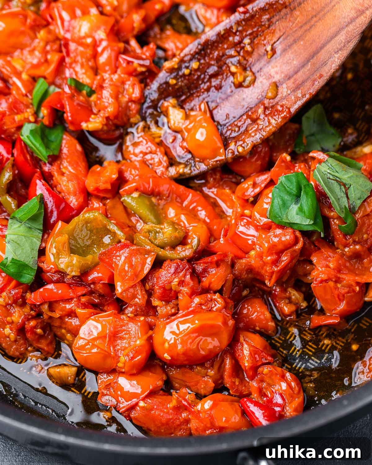 Zesty Cherry Pepper Preserve 7 Cooked cherry pepper spread simmering in a large pan, showcasing its rich texture and color.