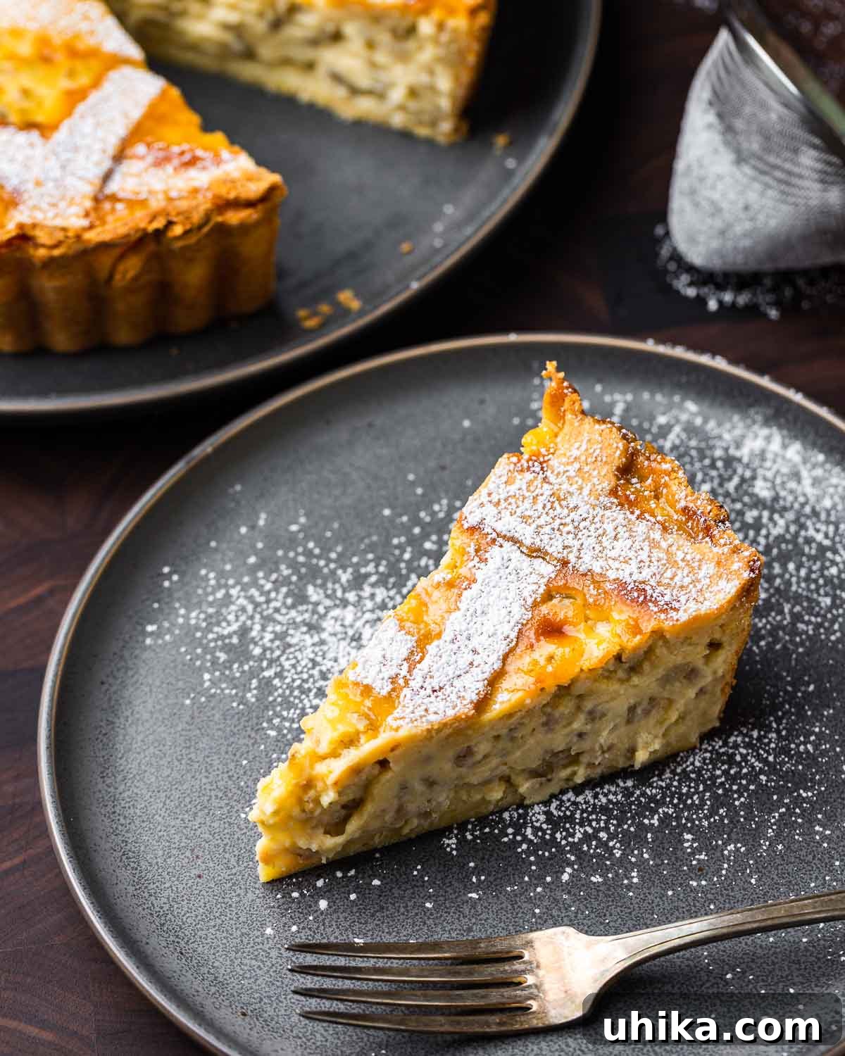 Naples' Signature Easter Dessert 11 Slice of pastiera Napoletana in grey plate.