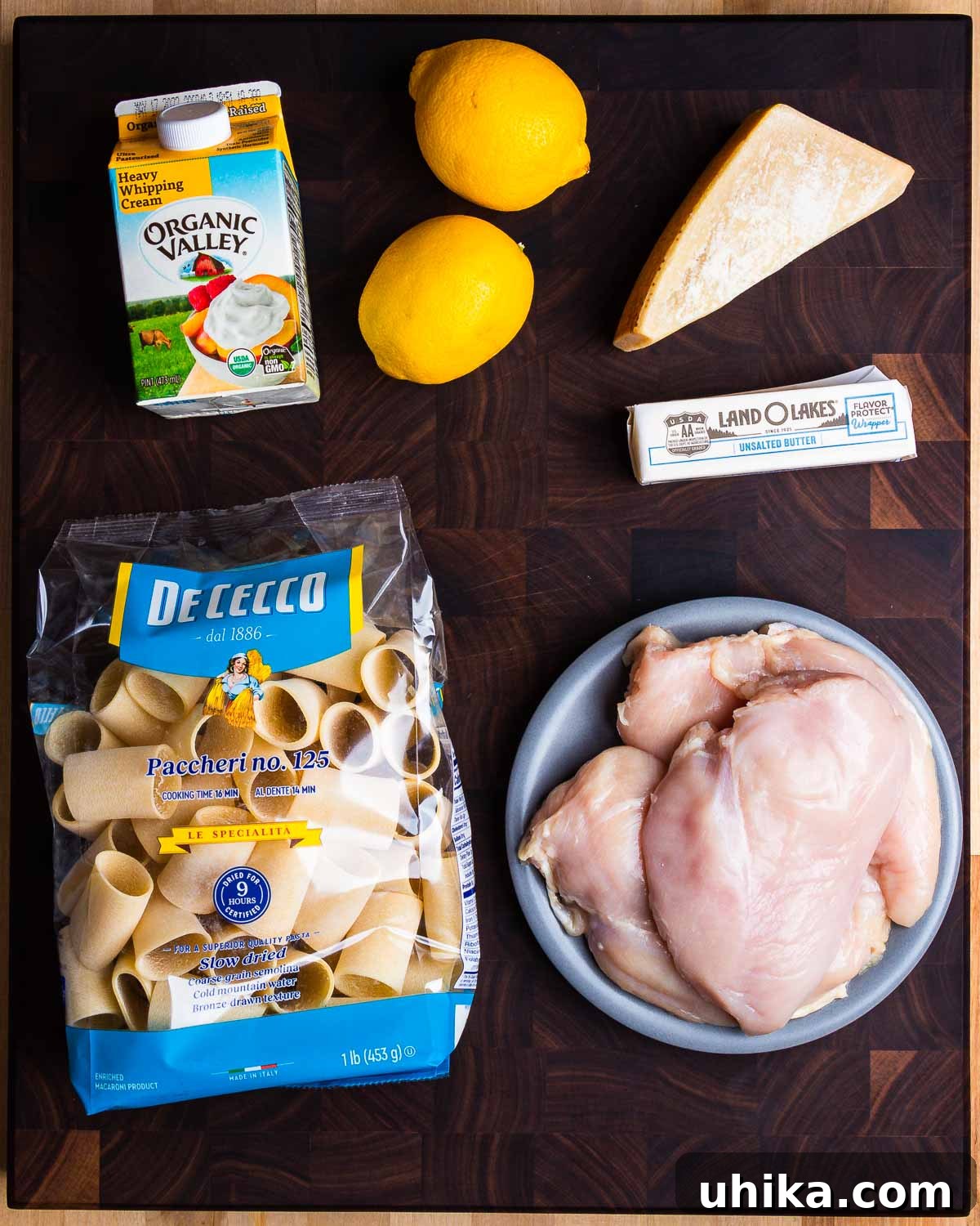 Luscious Lemon Chicken Pasta 3 Ingredients shown: heavy cream, lemons, Parmigiano Reggiano, butter, pasta, and chicken breasts.