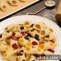 Generations of Hungarian Kiffles 5 A serving plate piled with fresh baked Hungarian kiffles in assorted flavors of cherry, poppy, almond, and apricot.