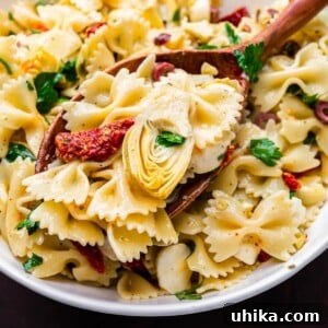 Mediterranean Sun-Dried Tomato and Artichoke Pasta Salad 8 Pasta salad with sun-dried tomatoes and artichokes featured image. A delightful, colorful dish.