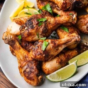 Effortless Cajun Roasted Drumsticks 8 Platter of Baked Cajun chicken legs for featured image.