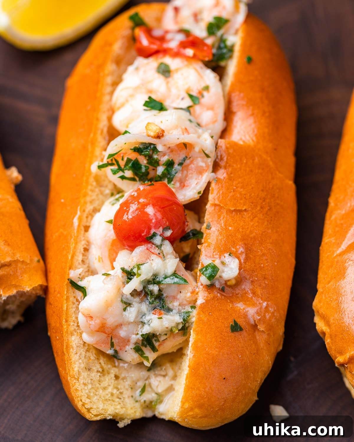 A close-up shot of a shrimp scampi roll on a cutting board, highlighting the succulent shrimp and perfectly toasted bread.