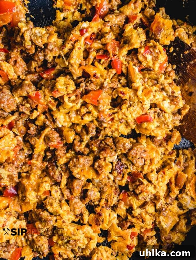 Chorizo and Eggs - sipandfeast.com #breakfastrecipes #eggrecipes #brunch #chorizo Chorizo and eggs finished cooking in pan.
