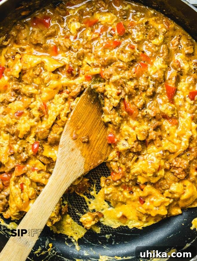 Chorizo and Eggs - sipandfeast.com #breakfastrecipes #eggrecipes #brunch #chorizo The chorizo and eggs are almost finished cooking in the pan.