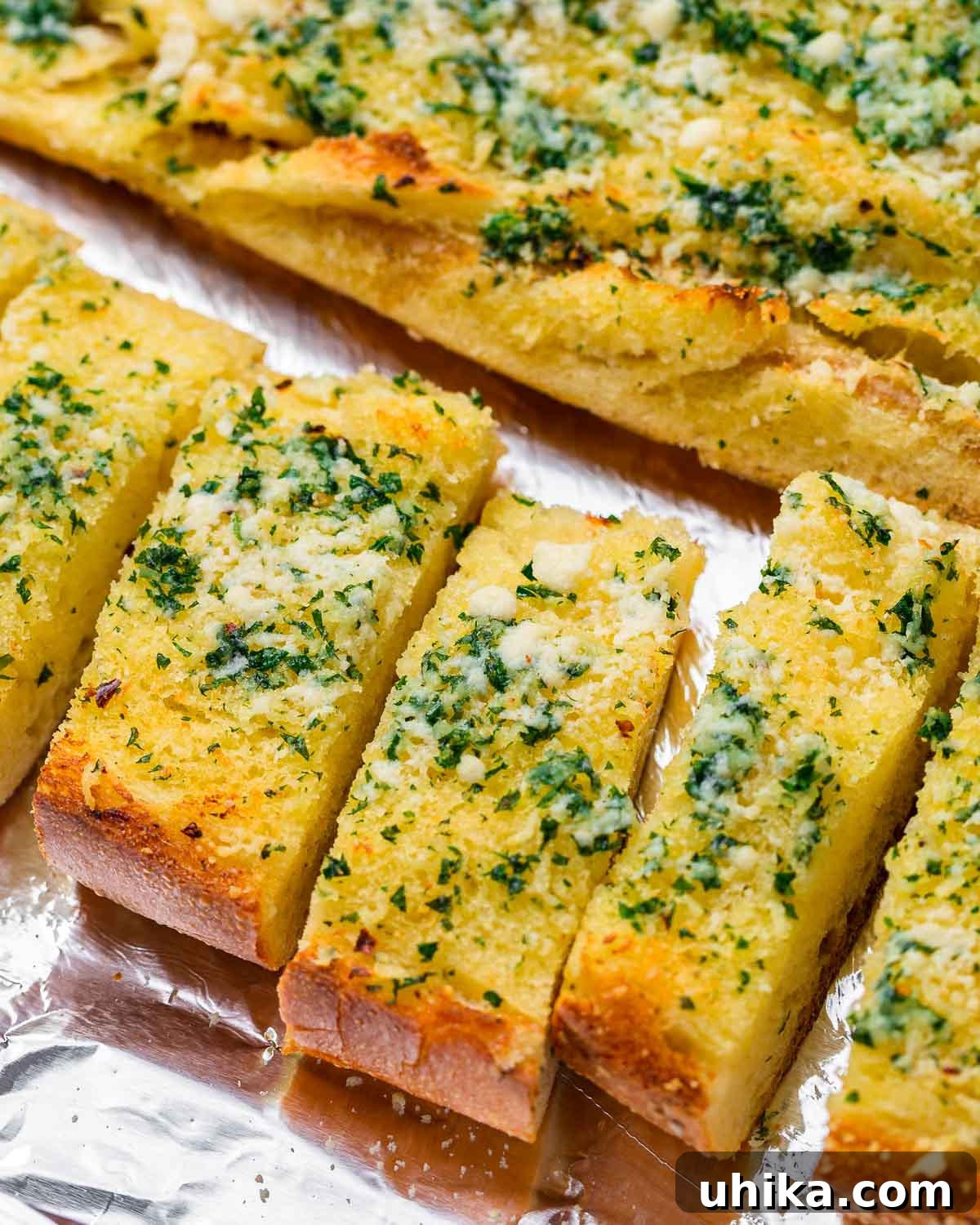 Garlic Bread 2 Pieces of garlic bread on foil baking sheet.