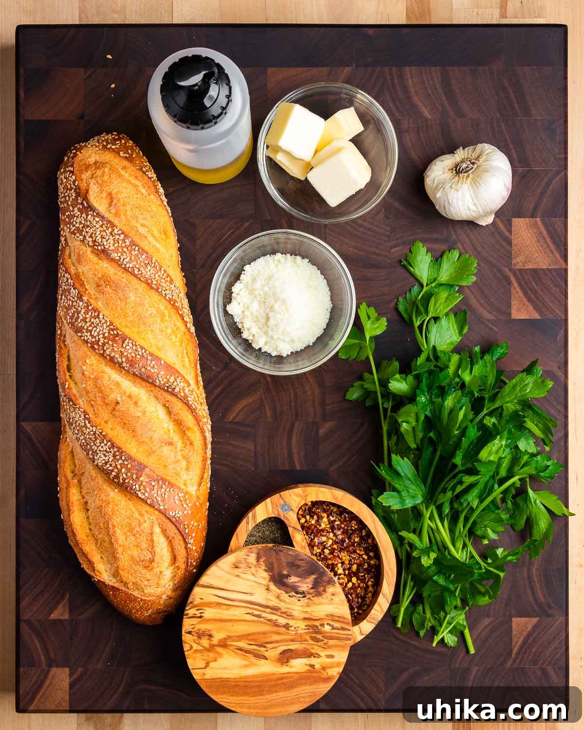 Garlic Bread 3 Ingredients shown: Italian bread, olive oil, butter, Pecorino, garlic, pepper, and parsley.