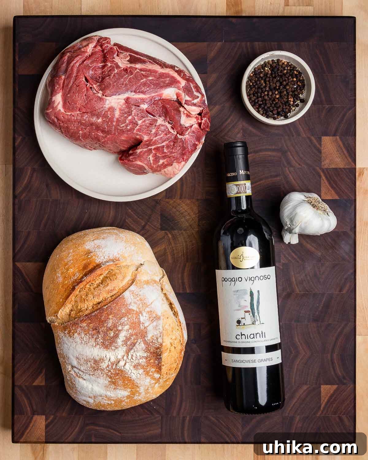 Tuscan Peppery Beef 3 Key ingredients for making Peposo: cubed beef chuck, whole black peppercorns, rustic Italian bread, a bottle of Chianti wine, and fresh garlic cloves.