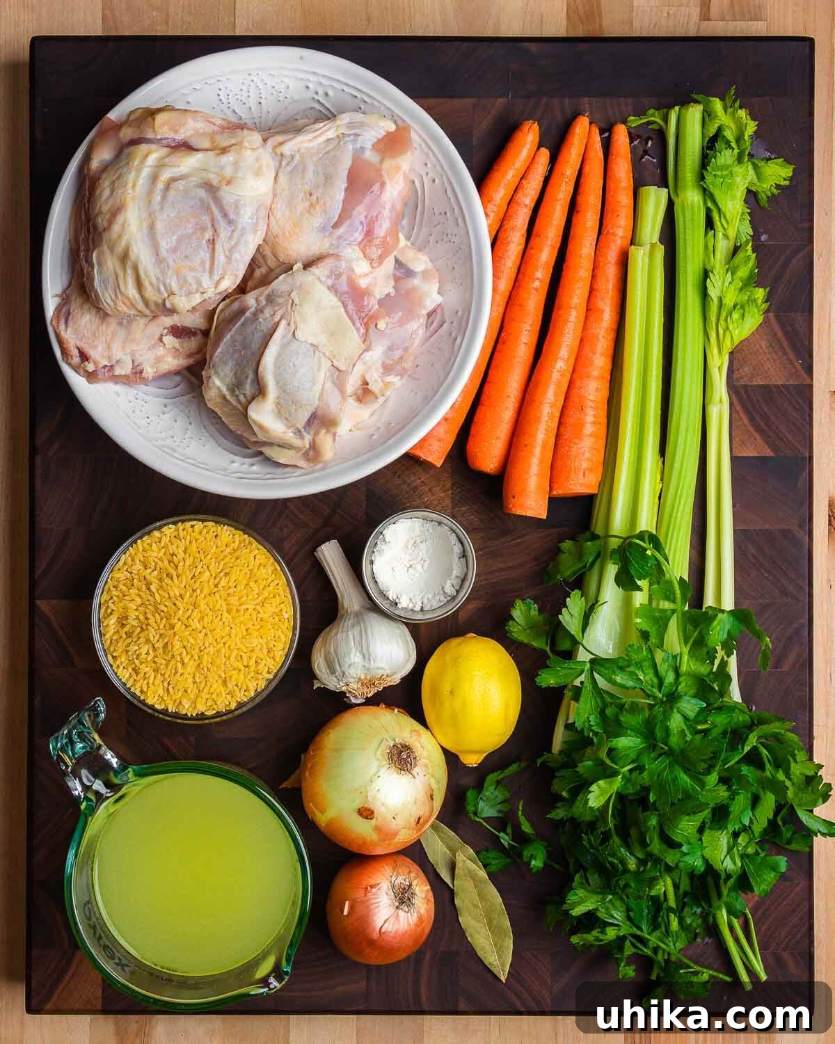 Bright Lemon Chicken Orzo Soup 3 Ingredients shown: chicken thighs, carrots, celery, orzo, onions, chicken stock, lemon, garlic, flour, and parsley.