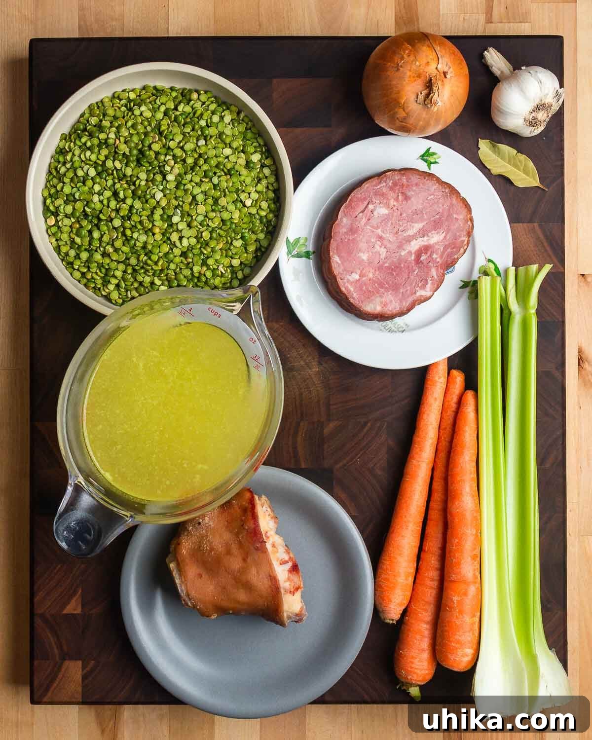 Hearty Smoked Ham and Split Pea Soup 3 Ingredients shown: split peas, onion, garlic, bay leaf, ham, chicken stock, ham hock, carrots, and celery.