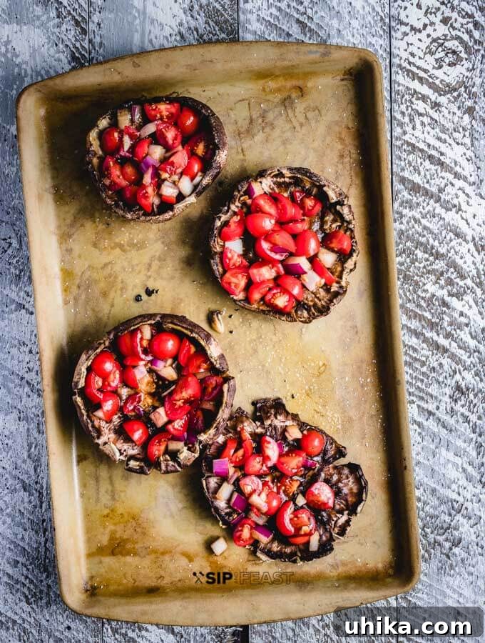 Stuffed portobello mushrooms with bruschetta. Baked portobello mushroom caps generously stuffed with balsamic bruschetta mixture.