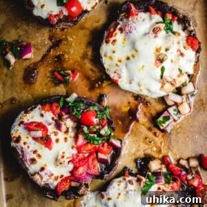 Flavorful Portobello Perfection 2 Baked portobello mushrooms with bruschetta and mozzarella
