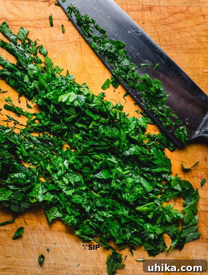 Fresh parsley for the finishing touch. Fresh green parsley, roughly chopped, for garnishing the baked portobello mushrooms.