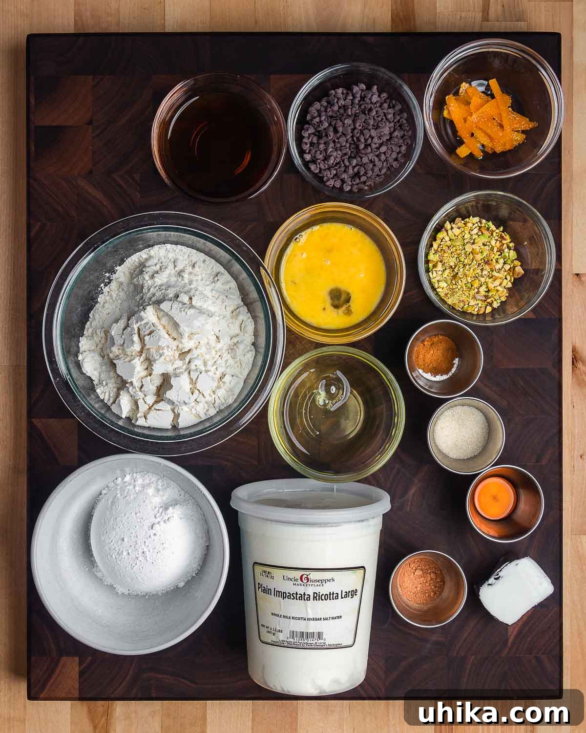 Cannoli Perfection 3 An overhead shot showcasing all the essential ingredients for making cannoli, including creamy ricotta impastata and various vibrant toppings, neatly arranged for preparation.