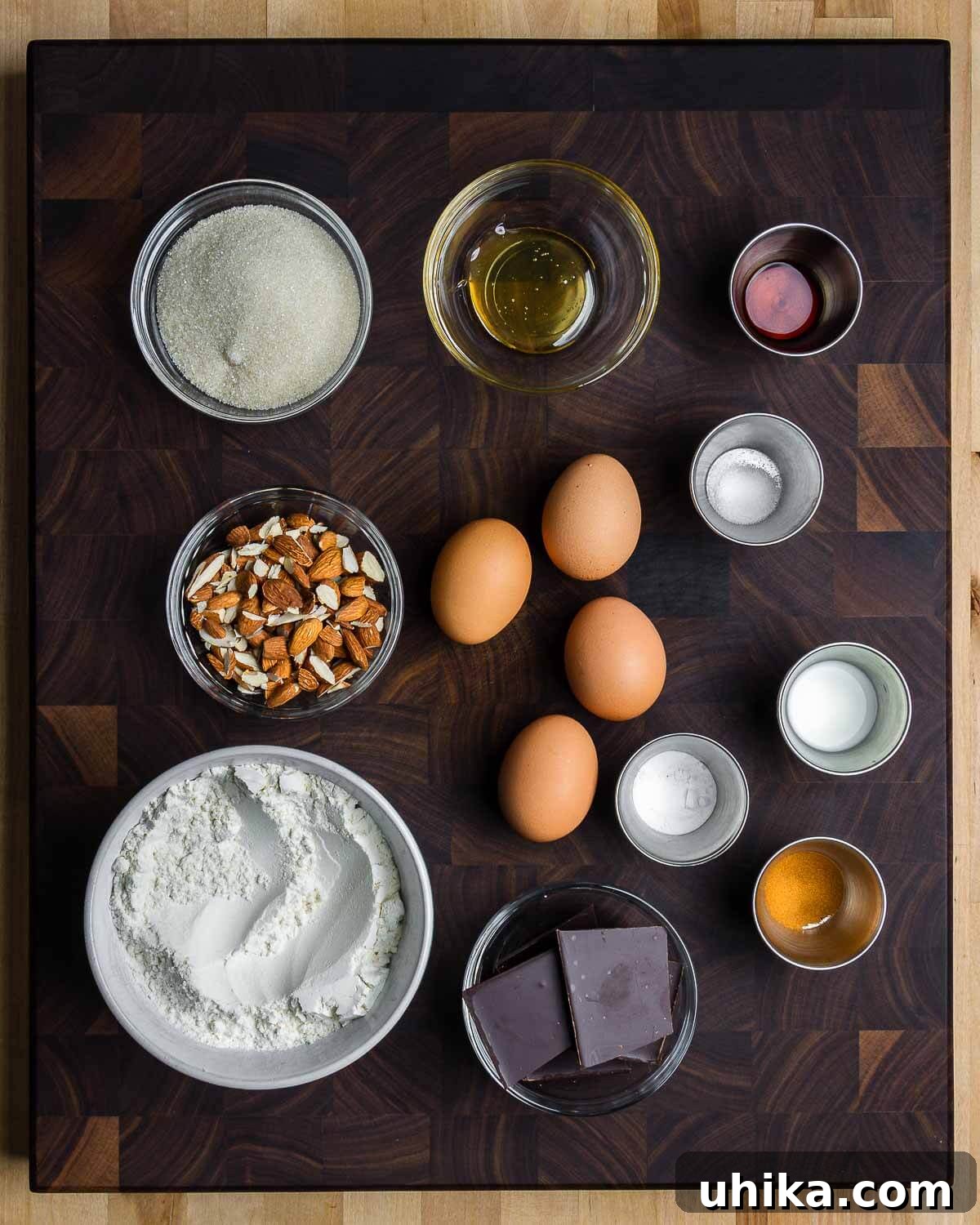 Twice-Baked Almond Delights 3 Ingredients shown: sugar, honey, vanilla extract, salt, almonds, eggs, milk, baking powder, cinnamon, flour, and chocolate.