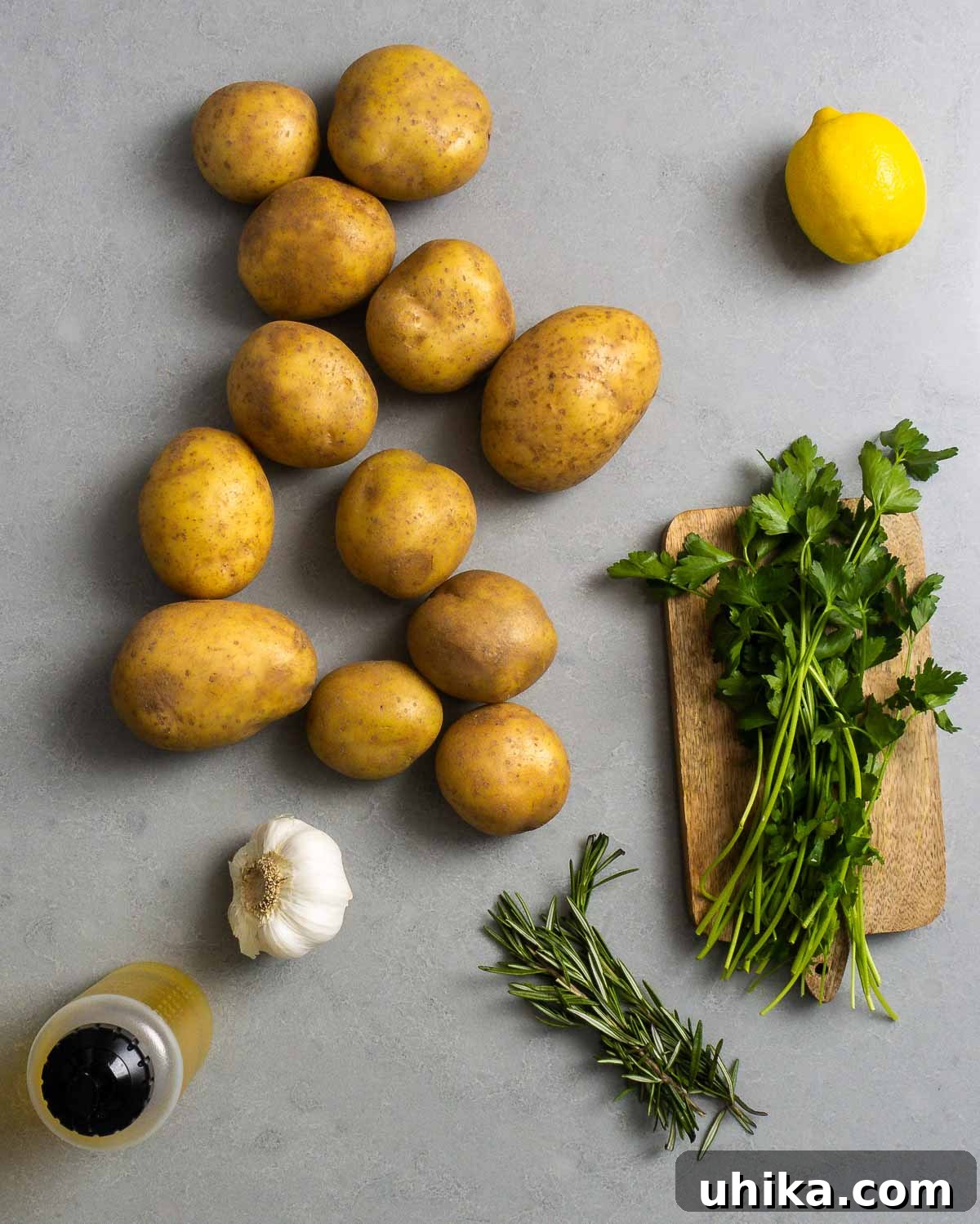 Golden Garlic Lemon Roasters 3 Ingredients for crispy roasted potatoes: Yukon Gold potatoes, fresh lemon, garlic cloves, olive oil, fresh rosemary, and flat-leaf parsley.