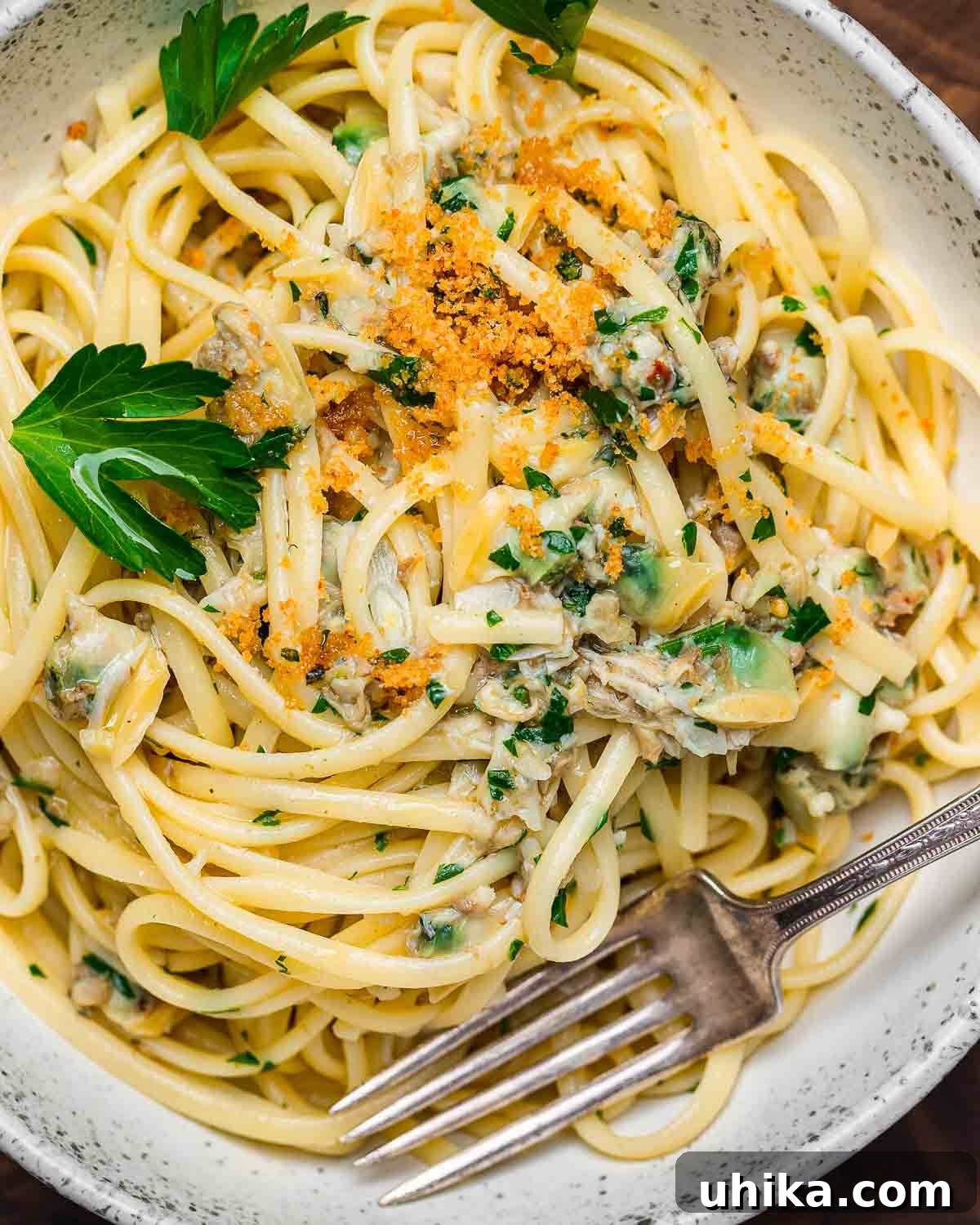 Easy Weeknight Clam Linguine 12 Bowl of linguine with canned clam sauce topped with seasoned breadcrumbs.