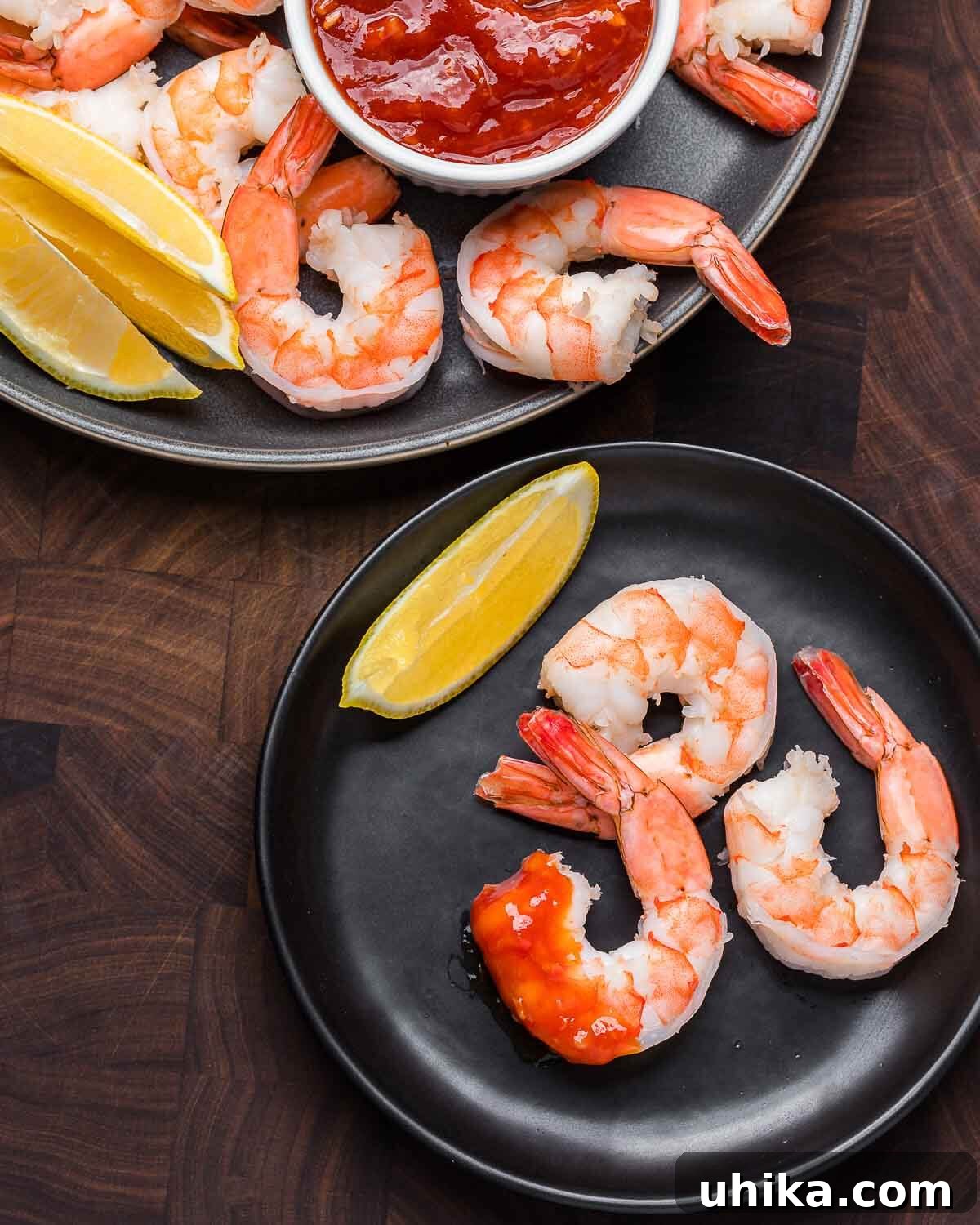 Chilled Prawn Perfection 8 Overhead shot of shrimp cocktail platter and small plate with shrimp dipped in cocktail sauce.