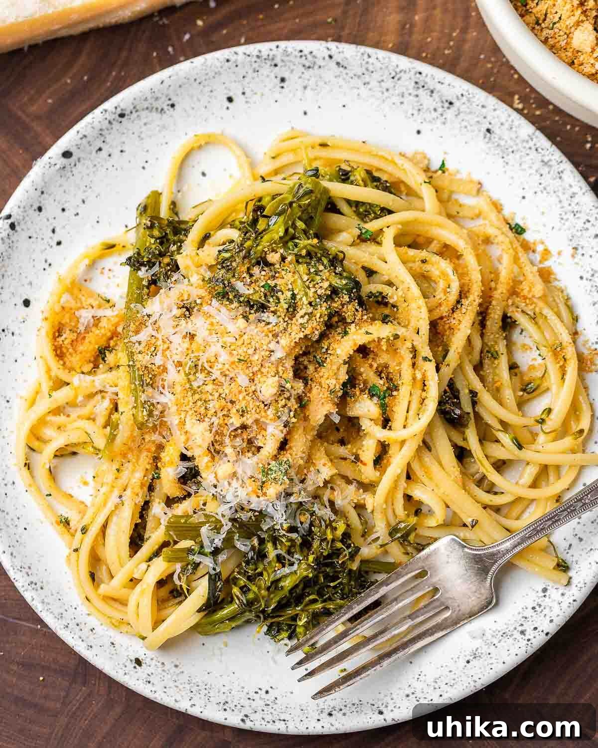 Plate of roasted broccolini pasta topped with toasted breadcrumbs.