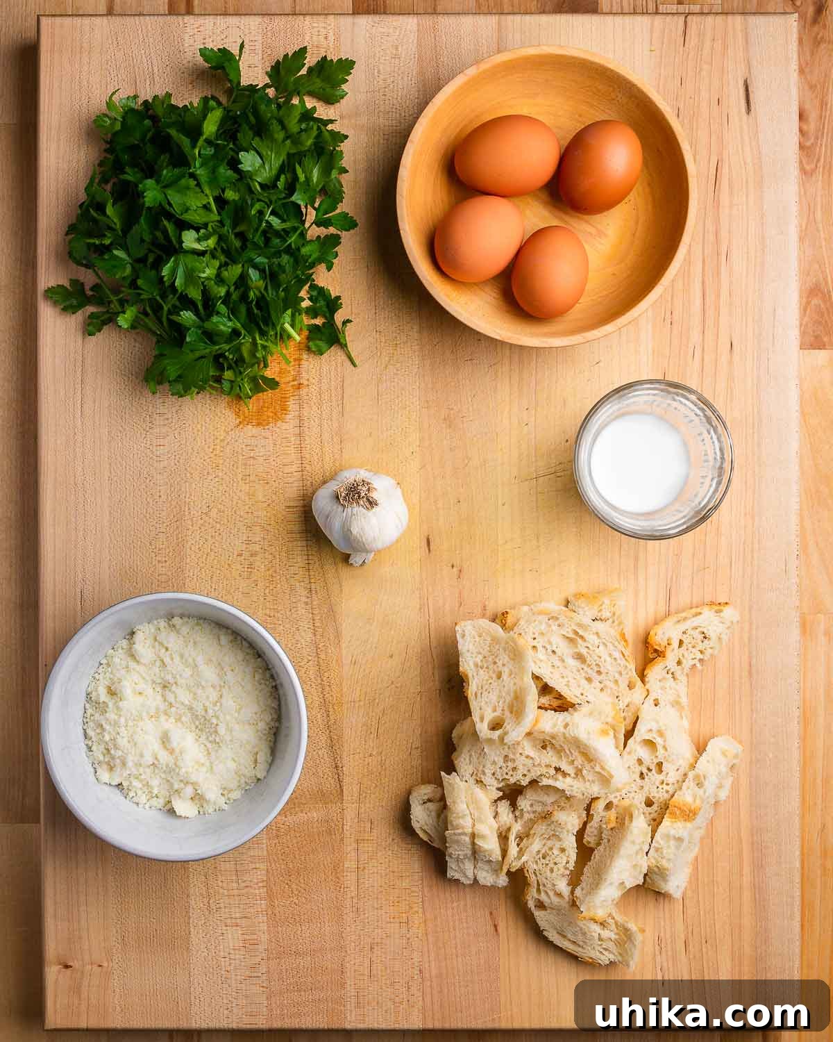 Golden Bread Fritters 4 Ingredients shown: parsley, eggs, garlic, milk, Pecorino Romano, and bread.