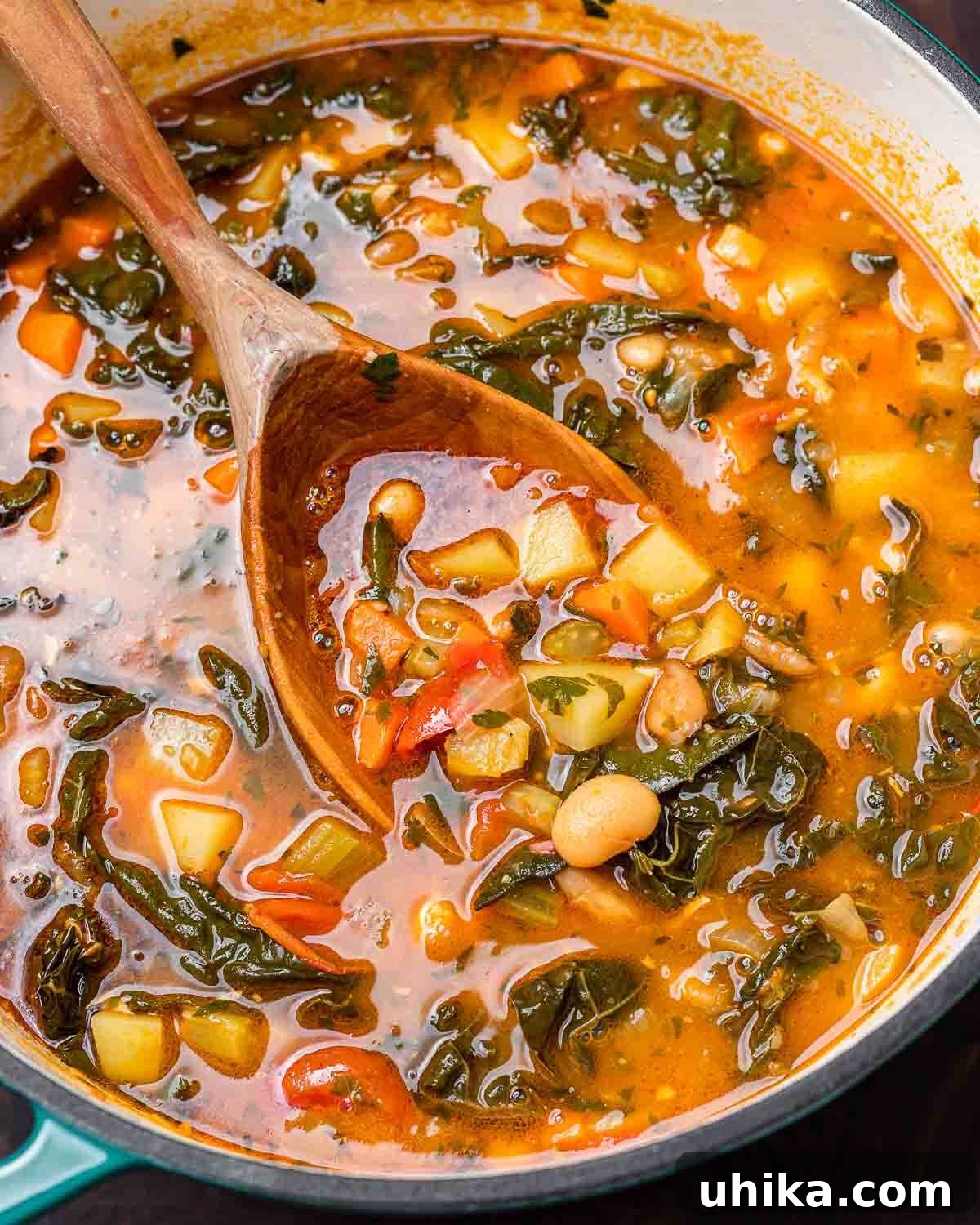 Hearty Vegetable Minestrone 7 Large pot of minestrone soup with wooden ladle.