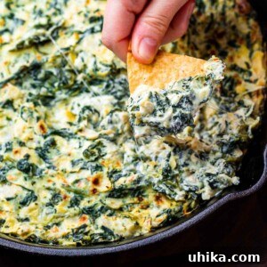 Spinach artichoke dip recipe featured image, golden and bubbly.