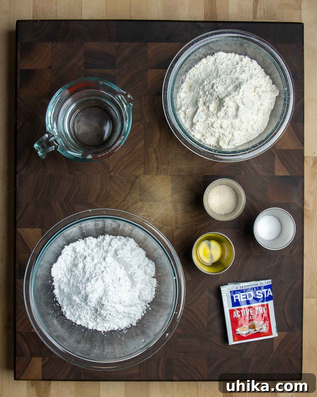 Italian Doughnut Delights 3 Ingredients shown: water, flour, powdered sugar, salt, sugar, olive oil, and yeast.