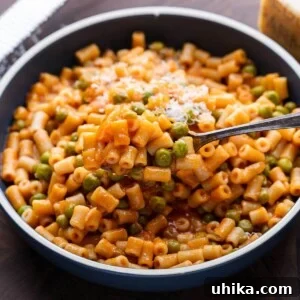 Pasta and peas in red sauce featured image.
