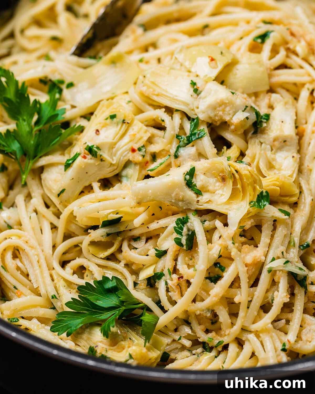 Golden Crumb Artichoke Pasta 10 Closeup shot of pan with pasta and artichoke hearts.
