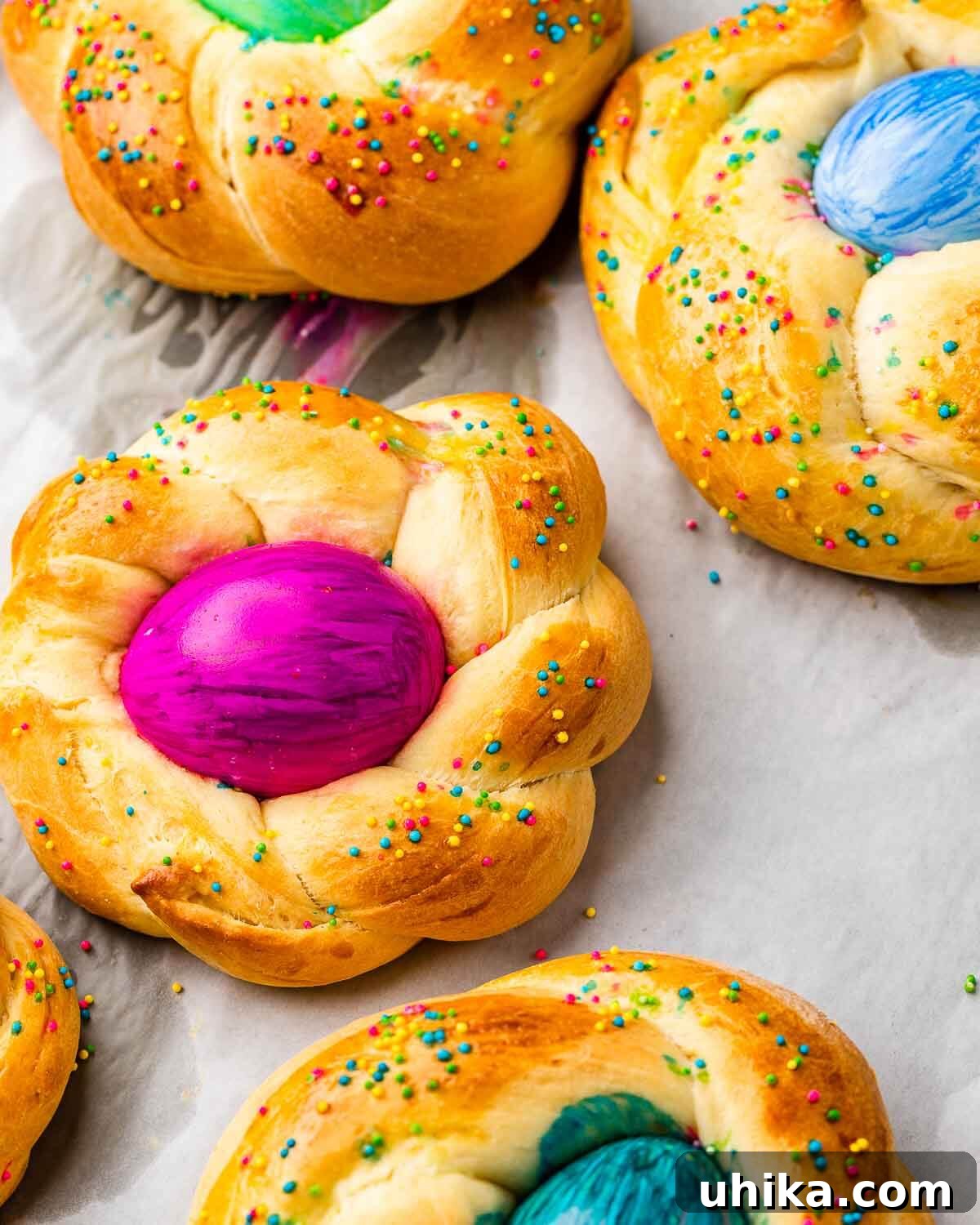 Italy's Festive Pasqua Bake 2 Closeup shot of Easter bread with colored eggs.