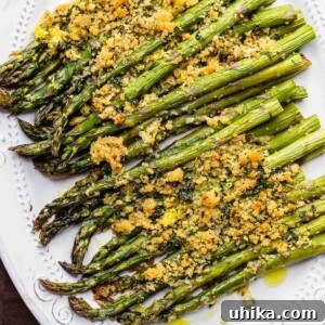 Crispy Parmesan Asparagus Bake 10 Baked asparagus with cheese and breadcrumbs featured image.