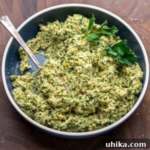 Vibrant Artichoke Pesto 8 Artichoke pesto recipe featured image, a vibrant green pesto with chunks of artichoke.