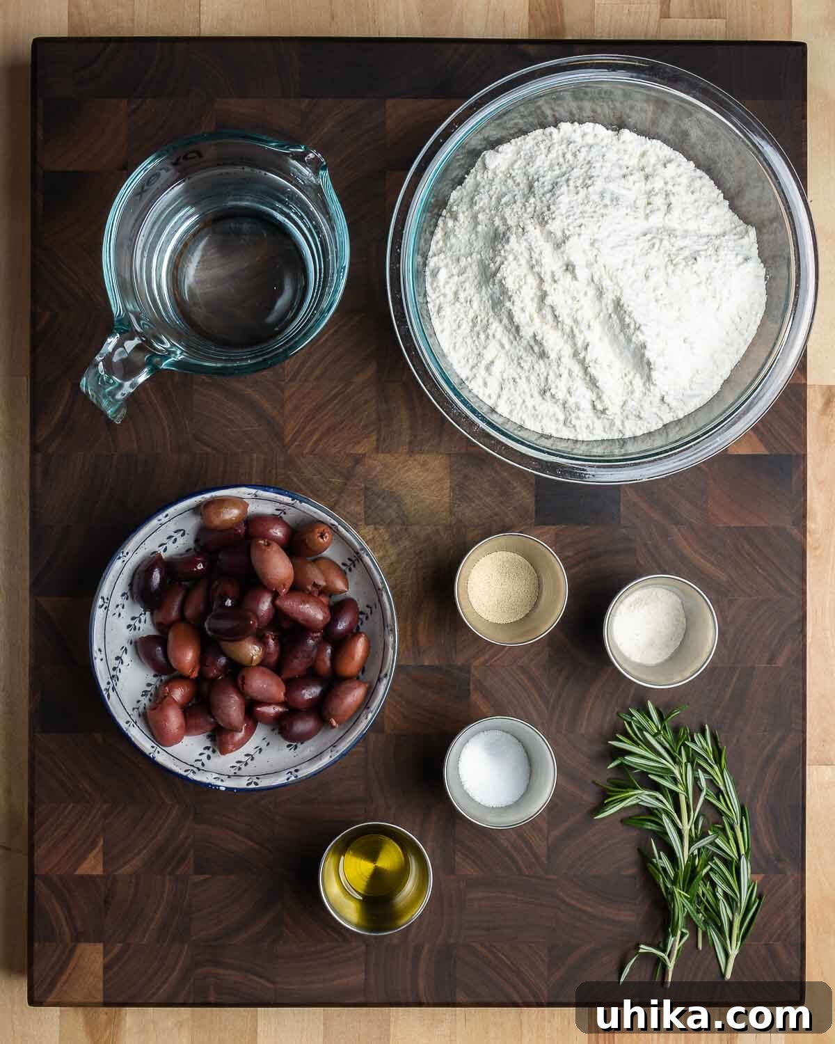 Mediterranean Olive Bread 3 Ingredients shown: water, bread flour, kalamata olives, yeast, diastatic malt powder, salt, olive oil, and rosemary.