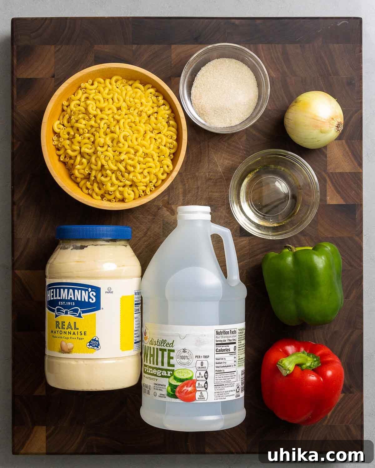 Ingredients shown: macaroni, sugar, onion, vegetable oil, mayonnaise, vinegar, bell pepper.