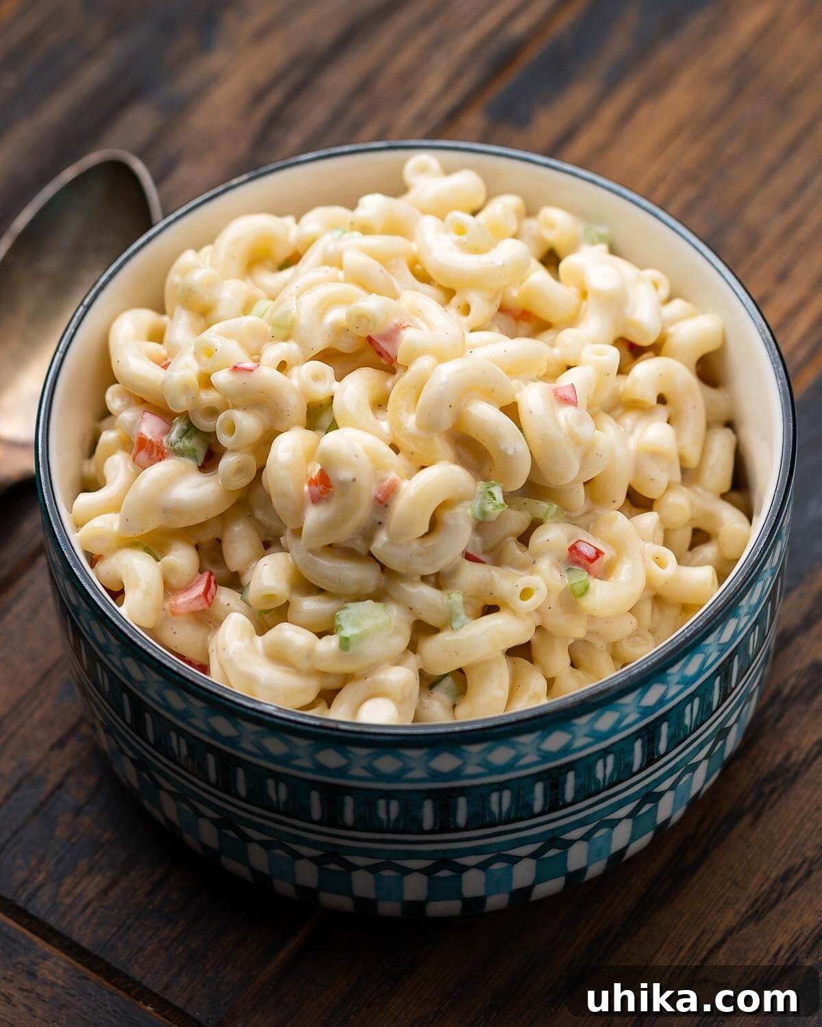 Blue bowl with deli style macaroni salad.