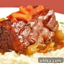 Cider-Braised Pork Belly with Cauliflower Puree and Caramelized Onions