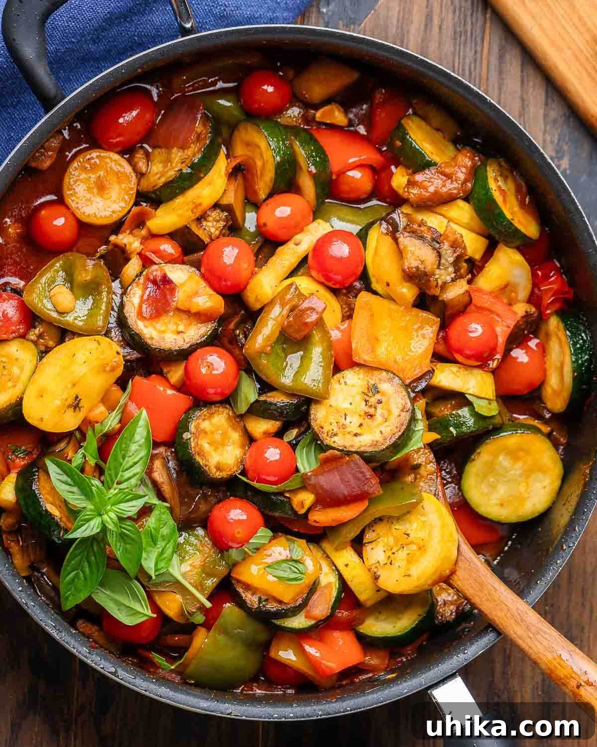 Overhead shot of a rich, vibrant Ratatouille stew presented in a black cast iron pan.