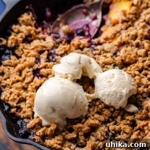 Sun-Kissed Peach and Blueberry Crumble 8 Blueberry peach crisp recipe featured image, showing a portion ready to be served.