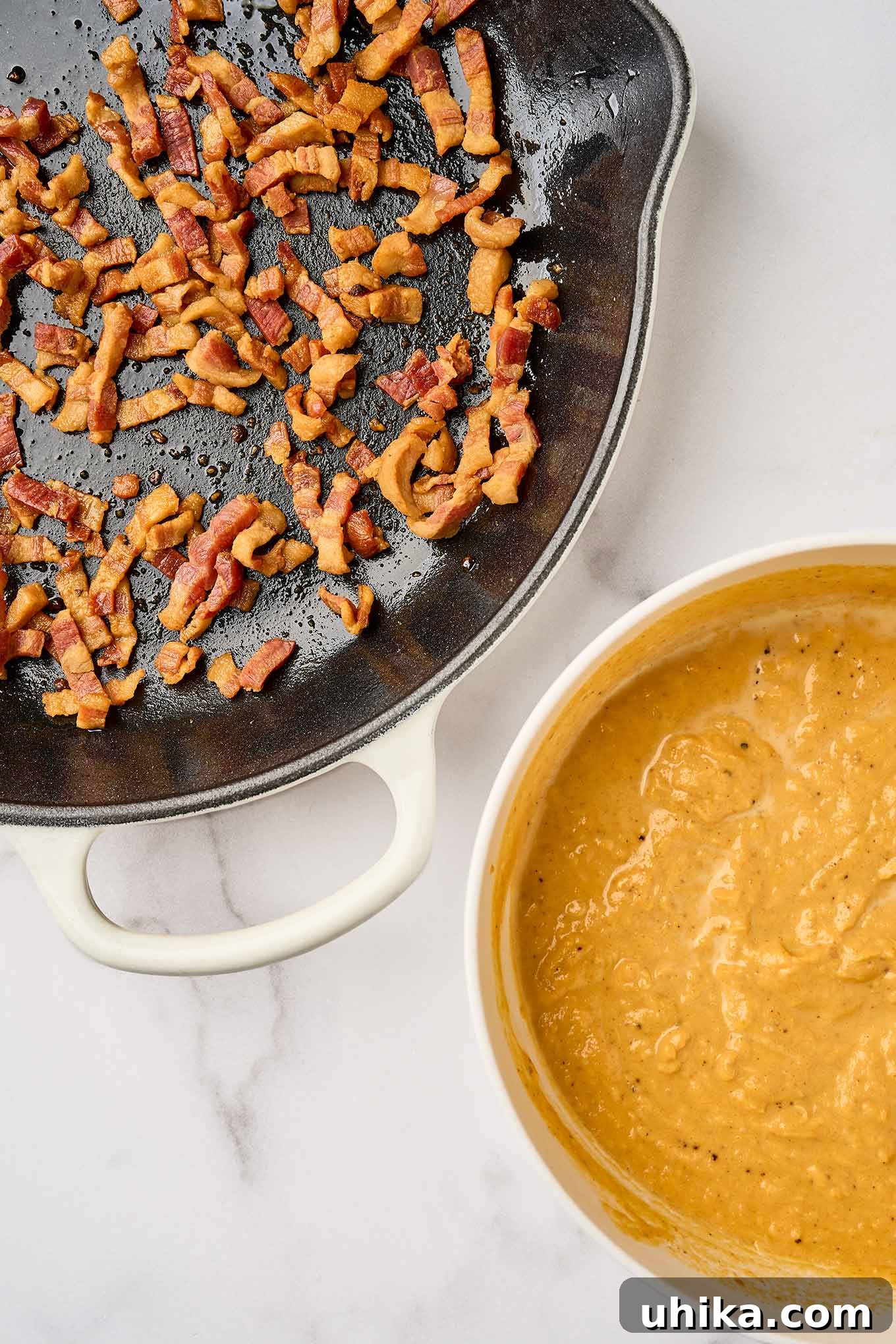 Golden Pumpkin Pasta with Crispy Pancetta and Creamy Parmesan 4 First steps in making creamy pumpkin pasta; crispy fried pancetta in a cast iron skillet, pumpkin puree, half-and-half, and nutmeg in a mixing bowl.