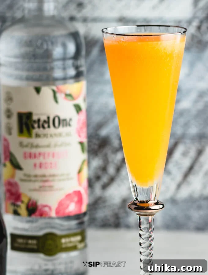Elevated Peach Bellini Cocktail A stunning Peach Bellini cocktail, perfectly presented in a delicate flute glass, ready to be enjoyed.