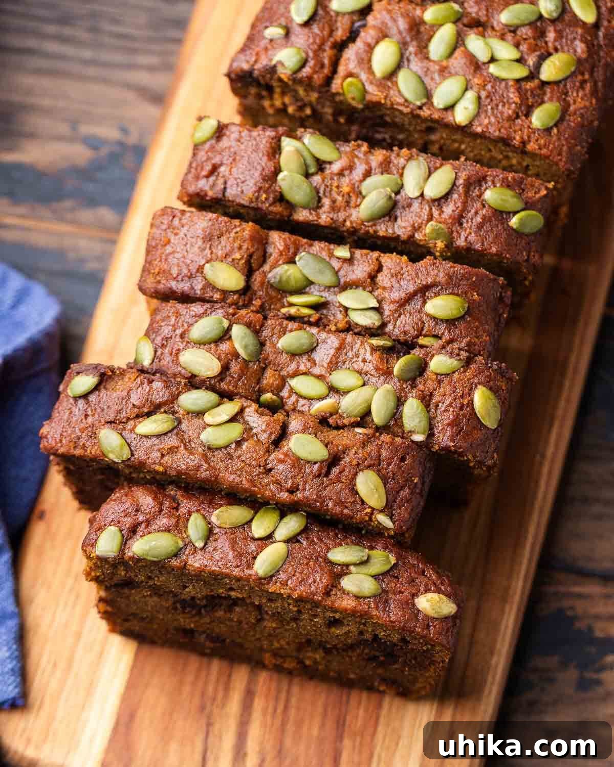 Golden Pumpkin Spice Bread 8 Overhead shot of chocolate chip pumpkin bread on cutting board, ready for serving or storage.