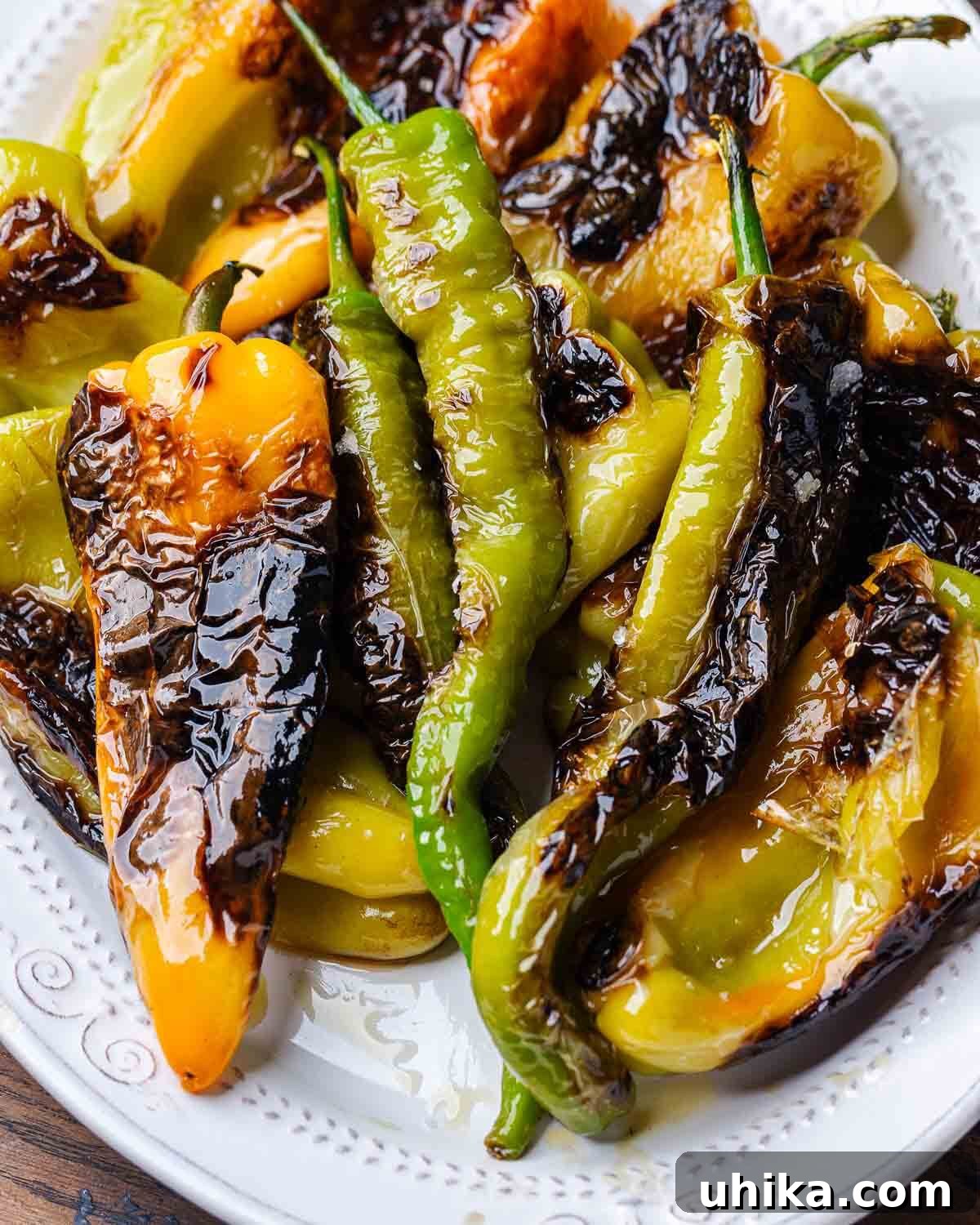 Classic Italian Sautéed Peppers 2 Assorted Italian fried peppers in a large white platter, garnished with fresh basil.