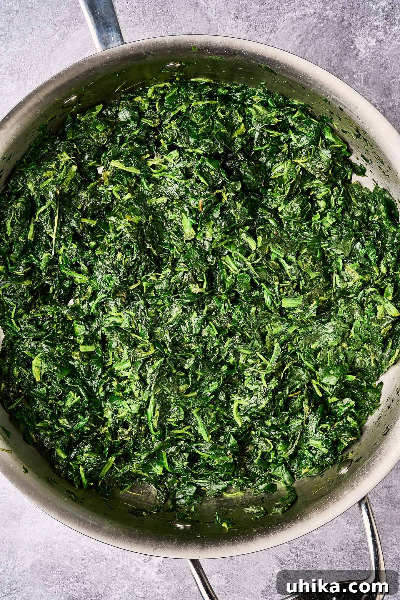 Crispy Bacon and Tangy Spinach Delight 4 First step in making sweet and sour spinach; chopped frozen spinach, liquid cooked off, waiting for sauce and bacon bits.