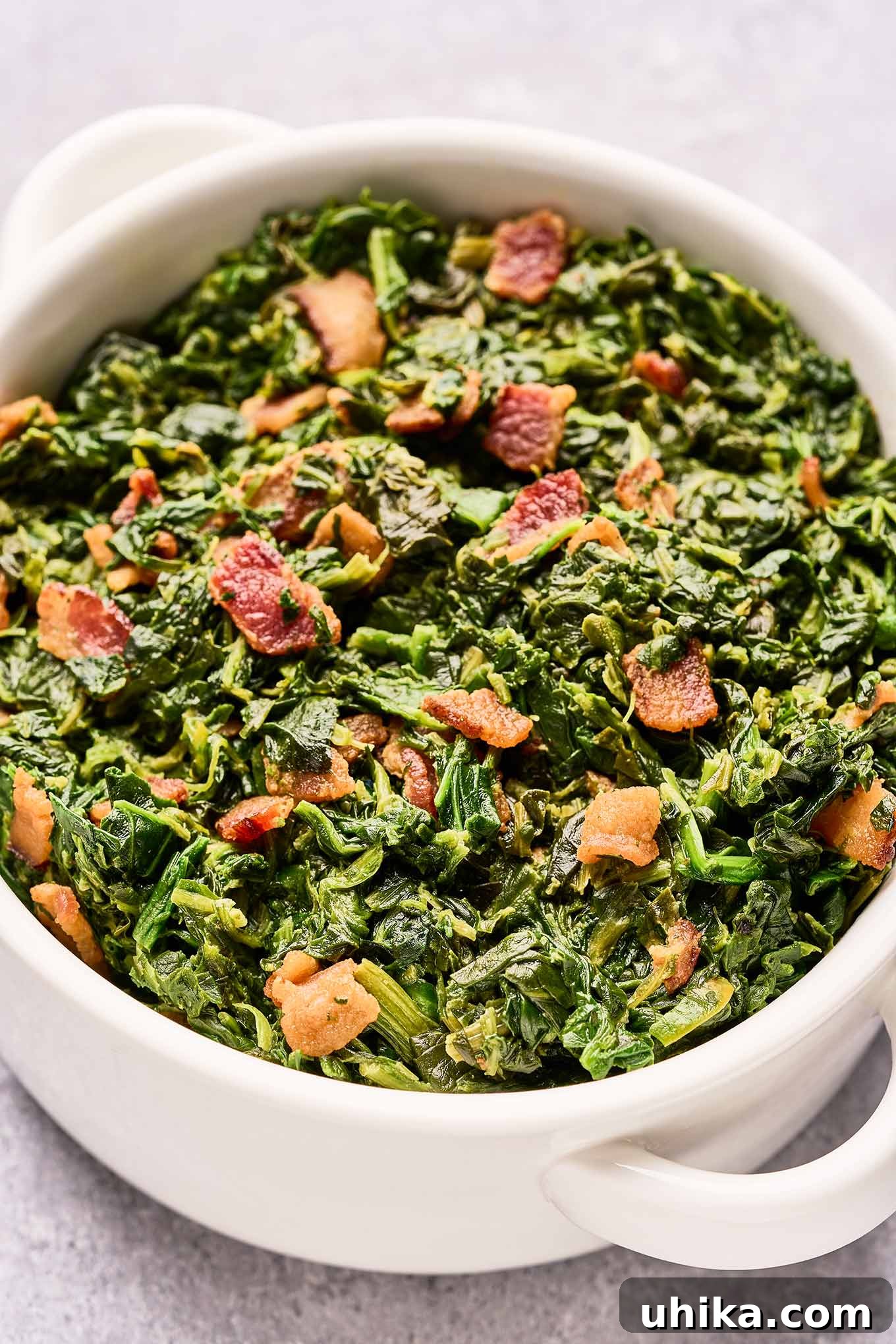 Crispy Bacon and Tangy Spinach Delight 6 A casserole of frozen chopped spinach sautéed in butter and combined with vinegar, sugar, and chunks of thick-cut bacon.