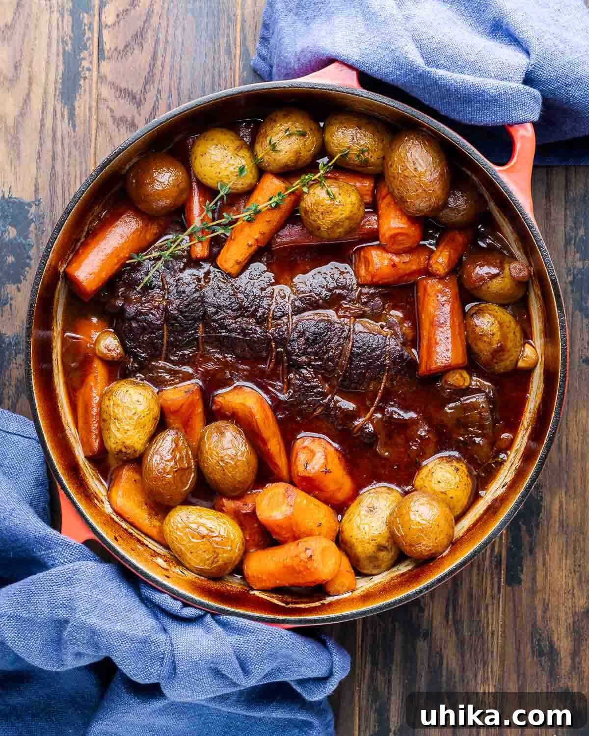 Fall-Apart Tender Beef 2 Overhead shot of fully cooked pot roast and vegetables in Dutch oven.