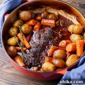 Featured image showing pot roast with vegetables in Dutch oven.