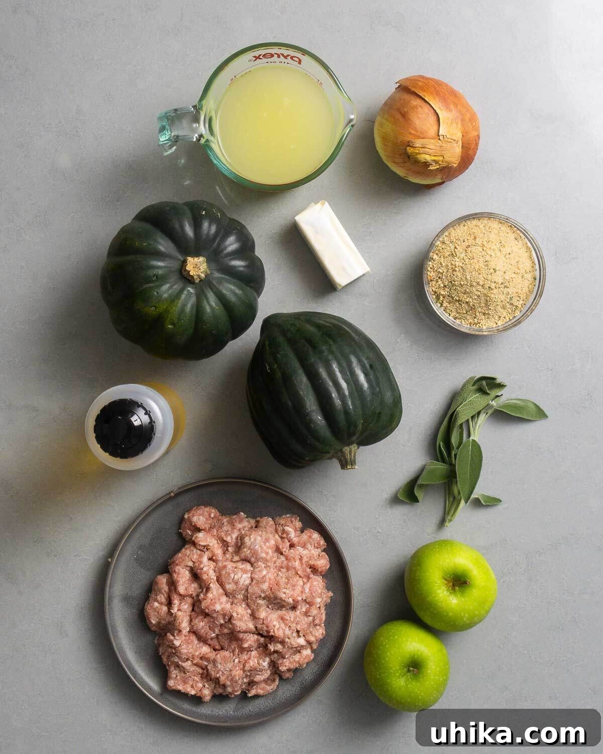 Savory Sausage and Acorn Squash Bake 3 Ingredients shown: chicken stock, onion, acorn squash, butter, breadcrumbs, olive oil, sage, bulk Italian sausage, and apples.